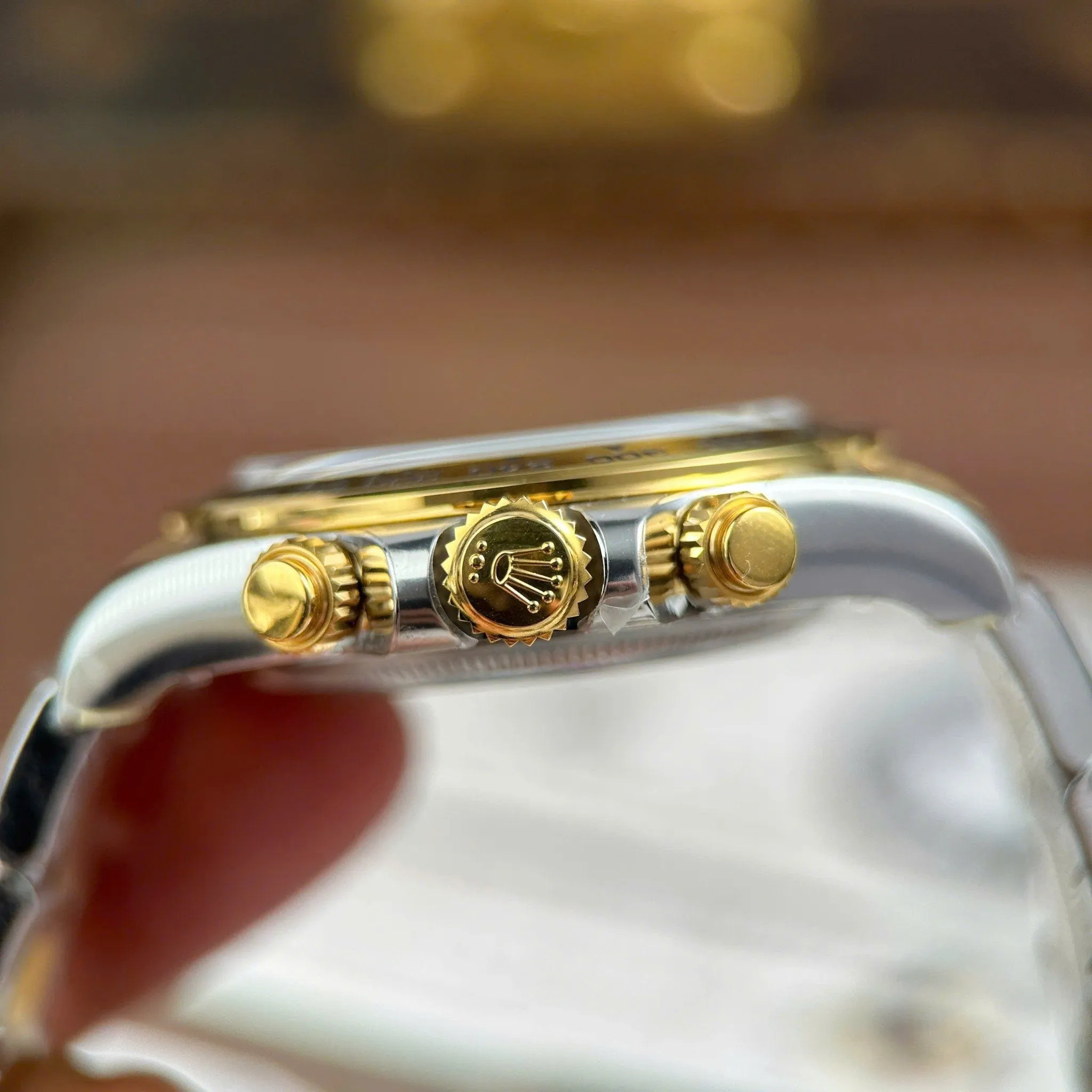 Daytona schwarzes Zifferblatt Gold Lünette Two Tone Oyster Armband
